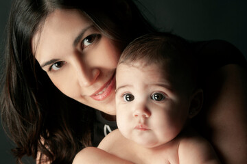 portrait of young mother with baby