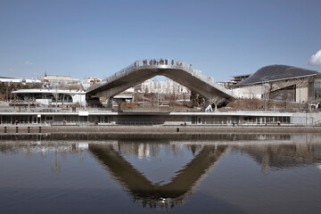 Soaring bridge over the Moskva River. Beautiful architectural composition. Sunny day. Blue sky.