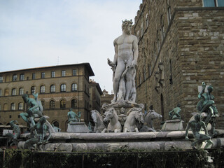 Obraz premium Fountain of Neptune near Palazzo Vecchio. Building in Florence, on Piazza della Signoria. Scenic landscape with Town Hall. Travel to European Union. UNESCO World Heritage Site