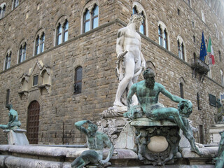 Fountain of Neptune near Palazzo Vecchio. Building in Florence, on Piazza della Signoria. Scenic landscape with Town Hall. Travel to European Union. UNESCO World Heritage Site.