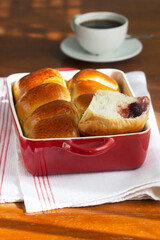 Austrian buns with cherry filling in a baking dish. Rustic style.