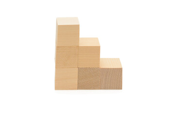 Obraz premium Wooden cubes stacked in staircase with steps. Isolated over white background
