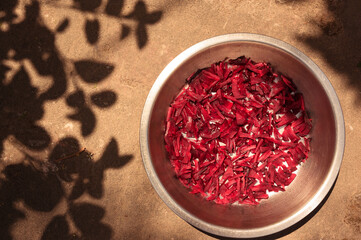 Chopped beet (Beetroot) vegetables in a bowl with Shade of the leaves in natural light.