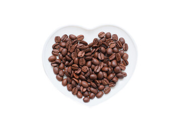 White porcelain plate in shape of heart with coffee beans. Isolated white background