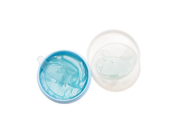 Hydrogel blue eye patches in container. Isolated white background