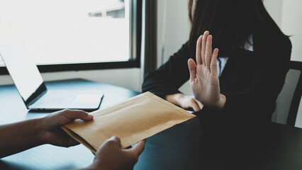 Government officials raise the hand refusing money to take the bribe money from business man the...