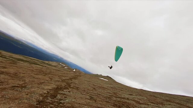 Parasailing Down the Mountain Slope in Norway, Aerial Drone View