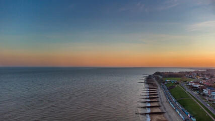 Fototapeta na wymiar A drone view of the sunset over Old Felixstowe in Suffolk, UK