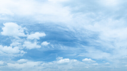 Naklejka na ściany i meble Blue sky with fluffy white clouds