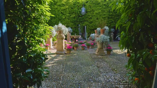 Very spring scene in Andalusia with flowers, typical courtyards of Cordoba, water fountains, lots of sunshine, very nice and cheerful scene, recorded in slow motion at 60 fps and 4K.