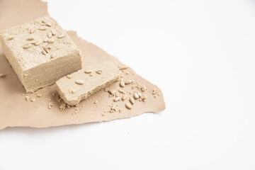 sunflower halva on a white table with seeds