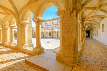 Tomar, Portugal - August 10, 2017: corridor inside small Claustro de Santa Barbara in Templar Castle of Tomar or Convent of Christ. Unesco Heritage, originally a fortress of the Knights Templar.