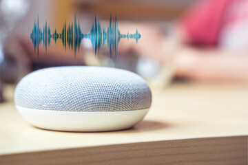 Smart speaker. Male working in background