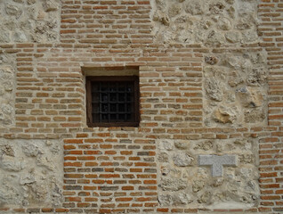 Fototapeta na wymiar Detail of brick and stones wall of the medieval Mudejar Church of Santa María la Antigua (13 century). Madrid