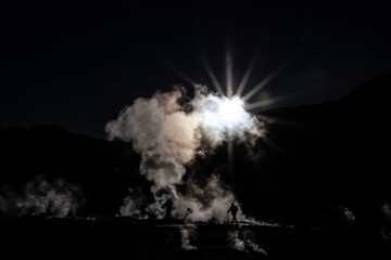 sun behind clouds in the Salar de Uyuni
