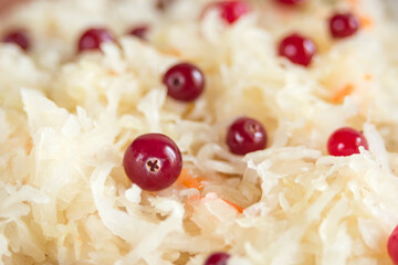Sauerkraut with cranberries close-up. Fermented vegetables. Super product for proper nutrition. Closeup.