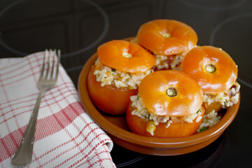 Rice stuffed tomatoes before going through the oven