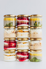 Trendy organic desserts in jars on a solid background. Concept for cafes, restaurants and restaurants with healthy products