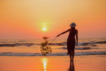 woman water sunset beach holiday vacation lifestyle happiness concept Focus on silhouette