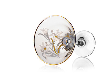 Transparent glass, martini glass, with flowers, on a white background f. with highlights