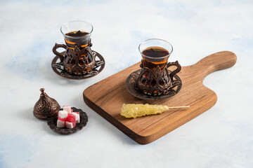 Obraz na płótnie Canvas Turkish tea set. Fragrant tea and sweet candies