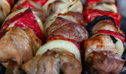 Skewers with red pepper and onion stir-fried on charcoal barbecue