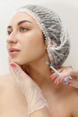 woman is given an injection at the beautician