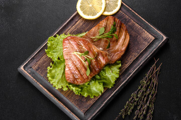Delicious juicy tuna steak grilled with spices and herbs