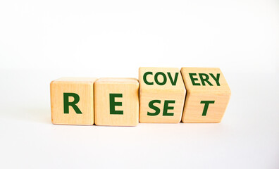 Recovery and reset symbol. Turned cubes and changed the word 'recovery' to 'reset'. Beautiful white background. Business and recovery - reset concept. Copy space.
