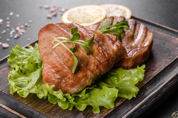 Delicious juicy tuna steak grilled with spices and herbs