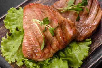 Delicious juicy tuna steak grilled with spices and herbs