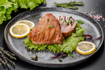 Delicious juicy tuna steak grilled with spices and herbs