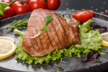 Delicious juicy tuna steak grilled with spices and herbs