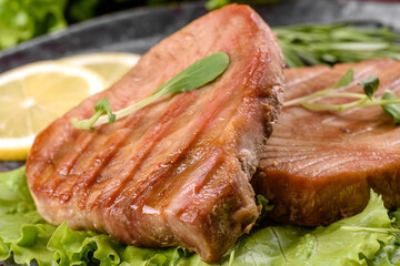 Delicious juicy tuna steak grilled with spices and herbs