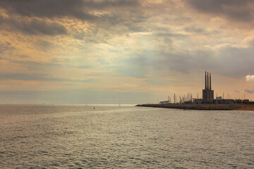 Seascape in the Mediterranean Sea with views of an old disused Thermal Power Plant for the production of electricity