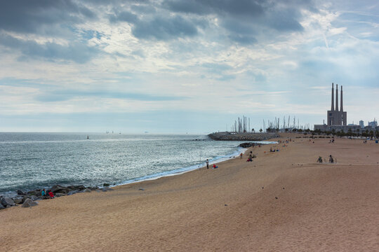 Barcelona beach in winter, with a calm sea.