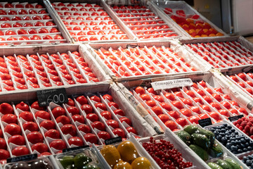 Fresh vegetables and fruits on the counter at the market place. Beautiful, delicious crop.