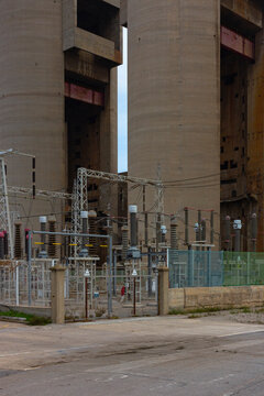 Old disused thermal power plant for the production of electricity in Barcelona behind a metal fence
