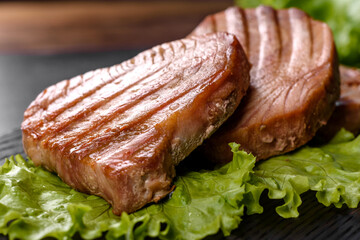 Delicious juicy tuna steak grilled with spices and herbs