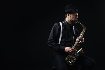 Fototapeta na wymiar Man playing jazz on saxophone