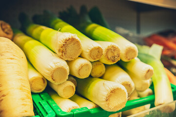 Close up of leeks on the supermarket shelf. 