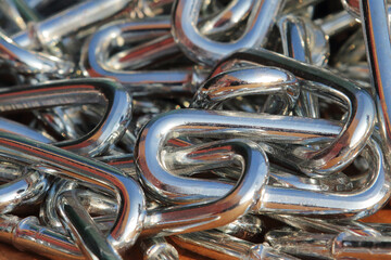 links of chrome construction chain close up for background on page