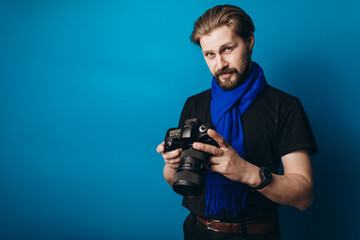 Bearded photographer using camera
