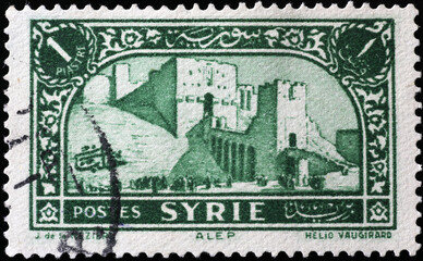 Cityscape of Aleppo on vintage syrian postage stamp