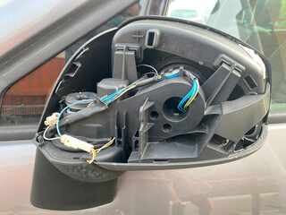 Car's rear view side mirror case broken  - Automotive insurance coverage, repair, garage concept