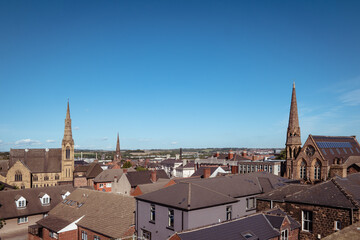 An elevated landscape view over the centre of the town of Rotherham, showing the rooftops with...