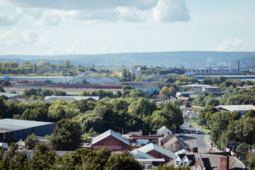 An elevated landscape view over the town of Rotherham, showing the urban industrial townscape including strip steel mills