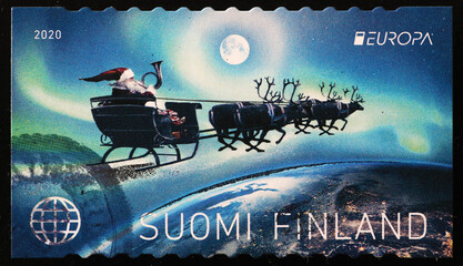 Santa Claus flying on his sleigh in finnish stamp