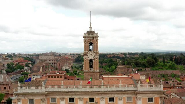 Drone view of Capitolium or Capitoline Hill, seat of the City Council of Rome, with the statue of Marcus Aurelius and Colosseo or Coliseum and Roman Forum in the background, monuments in Rome, Italy