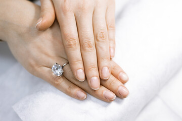 elegant female hands before procedure manicure in a beauty salon